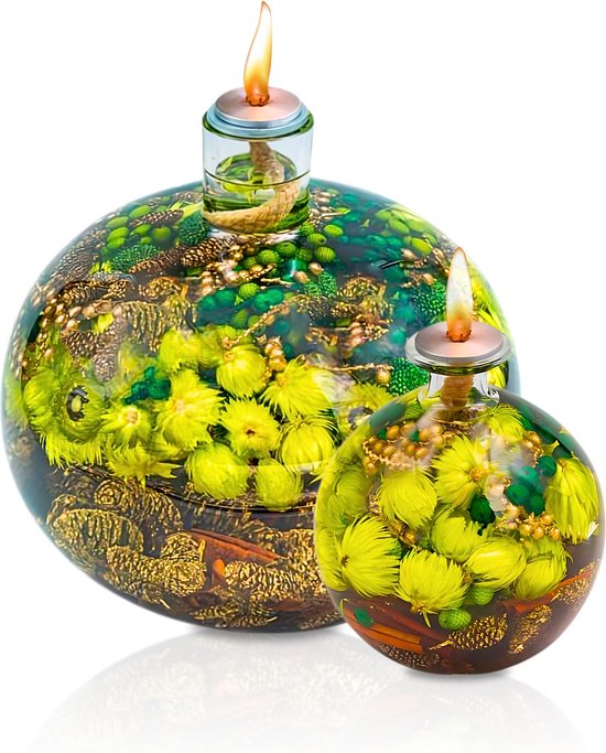 Oil lamp with dried green flowers inside the glass, detail view